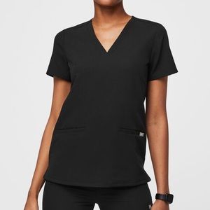 Medium FIGS 3-pocket scrub top in black.